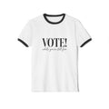 White t-shirt with black text 'VOTE! while you're still free' on a white background